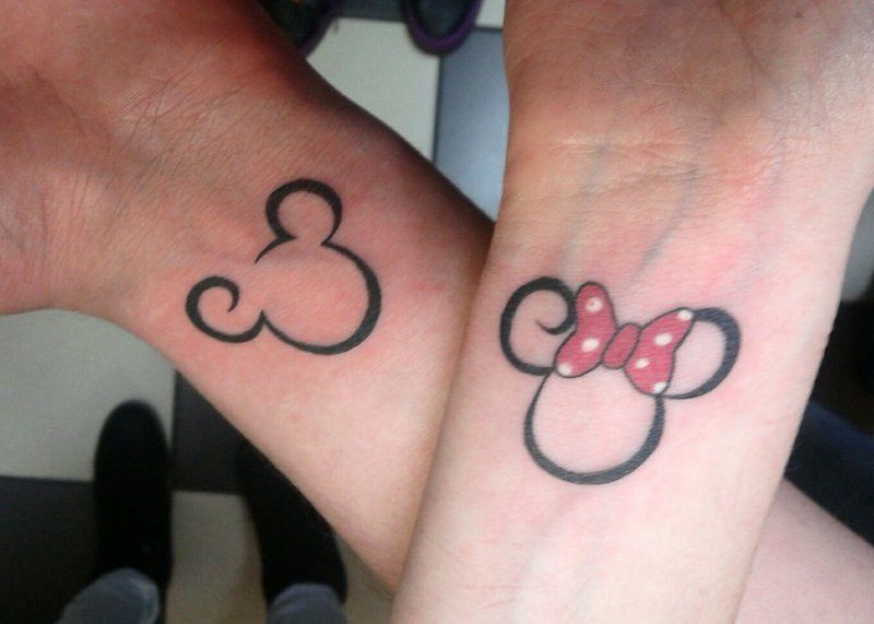 Cute Mickey And Minnie Outline Matching Tattoo On Couple wrist
