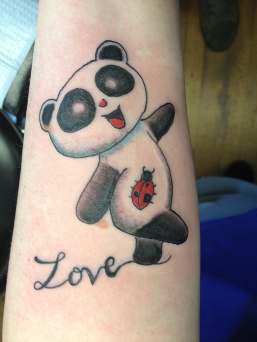 Cute Panda With Bettle On Stomach And With Love Tattoo On Left Arm Sleeve
