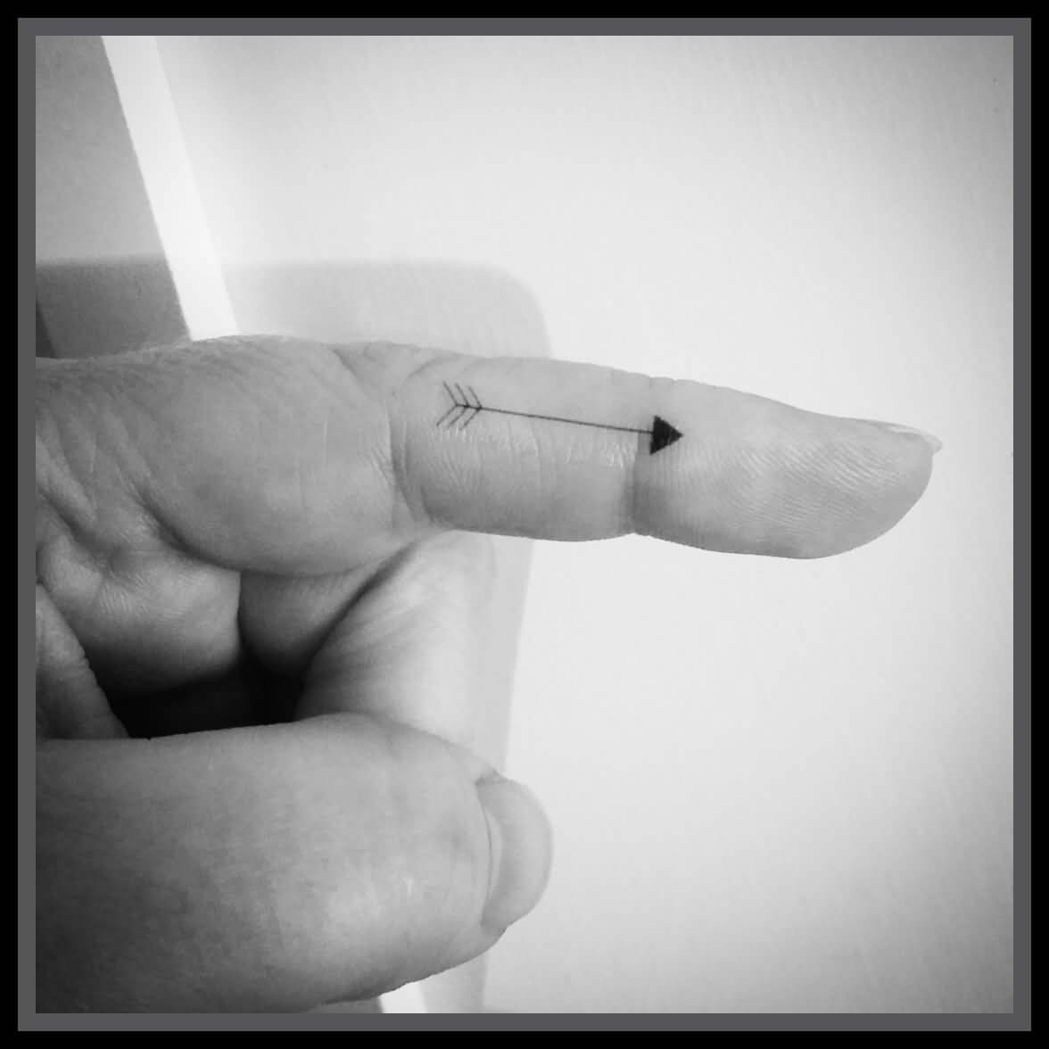 Cute Temporary Black Arrow Tattoo On Finger