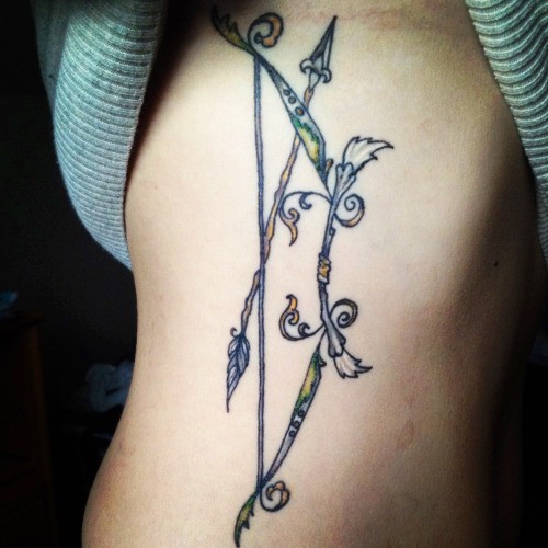 Fabulous Bow And Arrow Tattoo On Rib For Girl