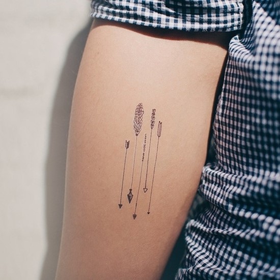 Five Small Arrows Tattoo On Arm