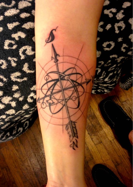 Girl Showing Her Compass Tattoo On Left Forearm
