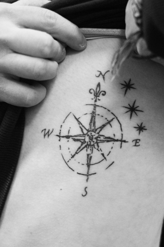 Girl Showing Her Compass Tattoo On Side Rib