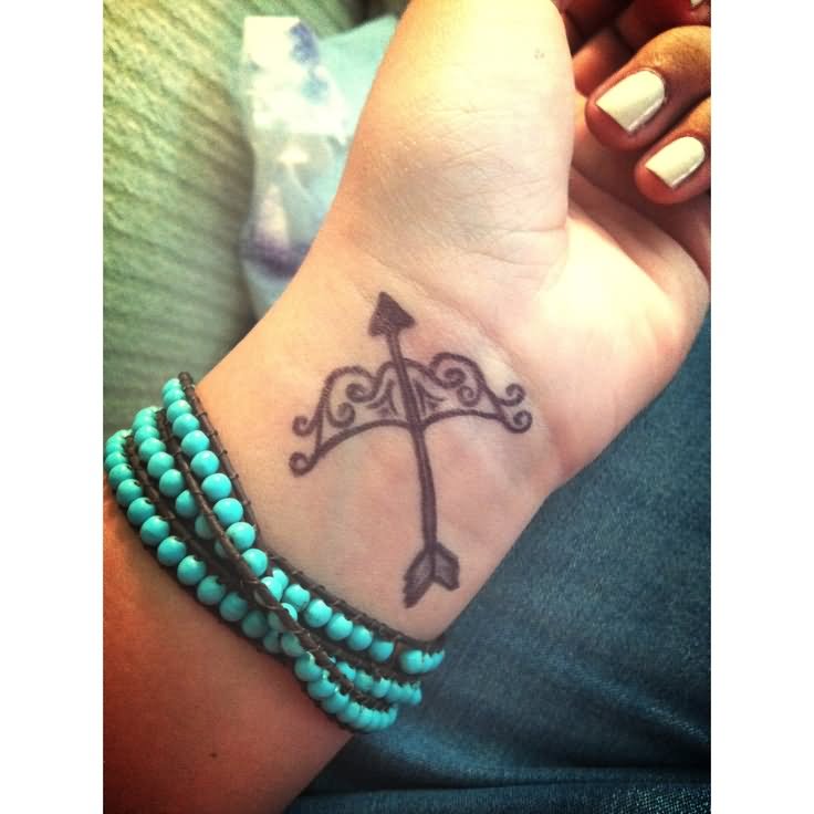 Great Sagittarius Bow And Arrow Tattoo On Wrist For Girl