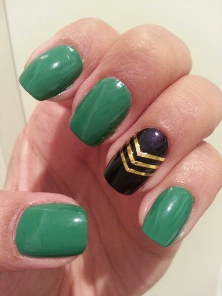 Green Glossy Nails With Black And Golden Accent Chevron Stripes Nail Art Design