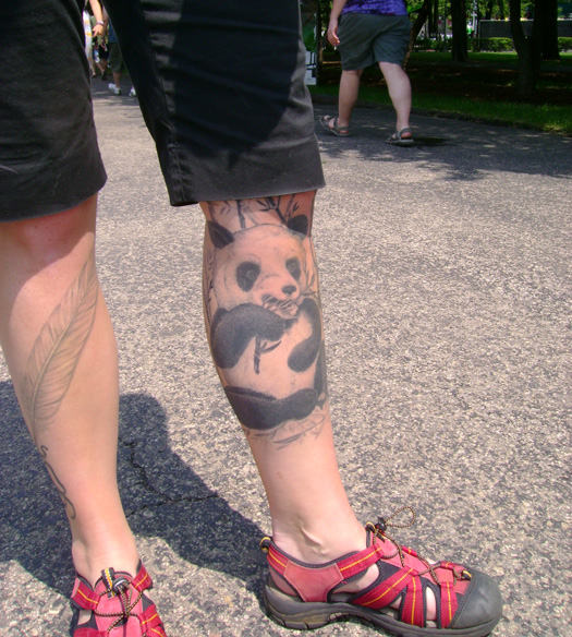 Grey Feather And Panda Tattoos On Both Legs For Boys