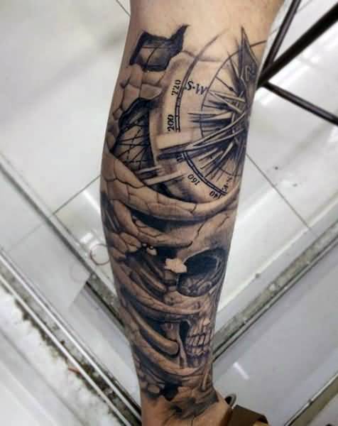 Grey Skull And Compass Tattoo On Leg