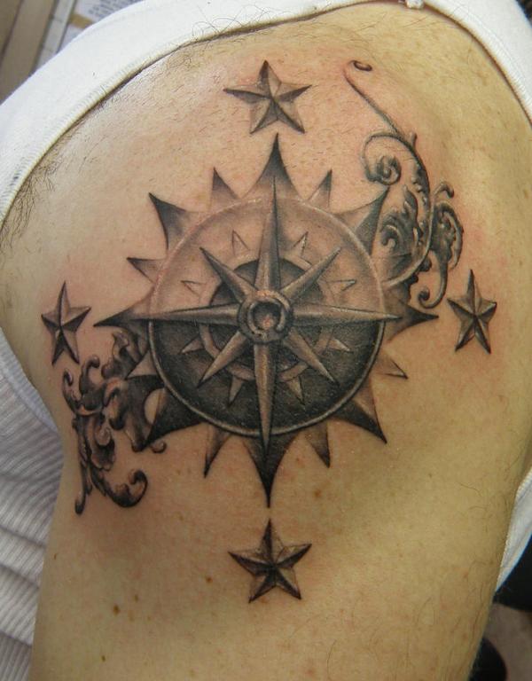Grey Stars And Compass Tattoo On Left Shoulder