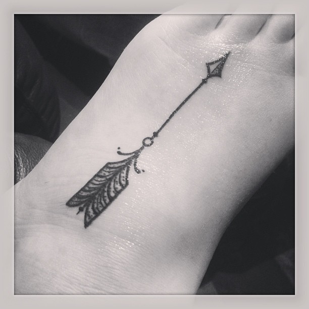 Incredibly Designed Black Ink Arrow Tattoo On Foot