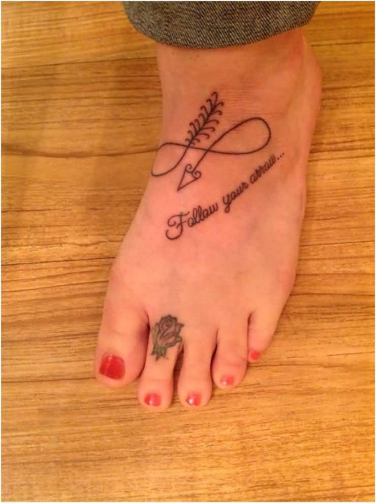 Infinity Arrow With Follow Your Dreams And Rose Tattoo On Foot