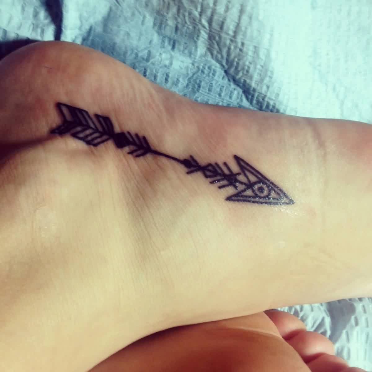 Innovative Black Ink Arrow Tattoo On Foot