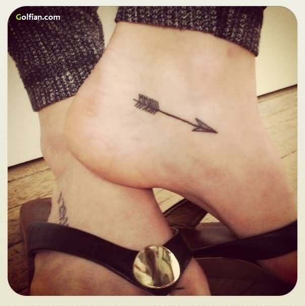 Innovative Black Inked Arrow Tattoo On Foot