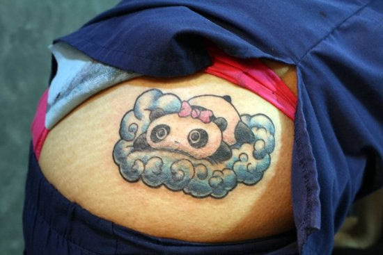 Lovely Panda Lying On Cloud Tattoo On Rib