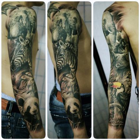 Magnificent Panda With Animals And Bird Tattoo On Full Sleeve