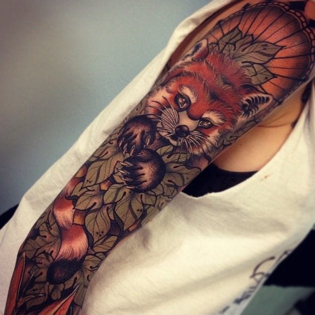 Magnificent Red Panda With Leaves Tattoo On Sleeve