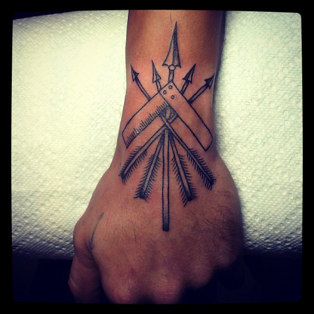 Many Arrows Crossed Tattoo On Wrist