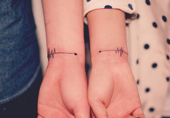 Matching Heartbeat Arrow Tattoos On Wrists