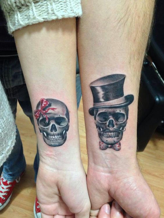 Matching Skull Tattoos On Couple Wrist