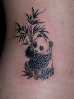 Nice Baby Panda Tattoo With Bamboo Tree Tattoo