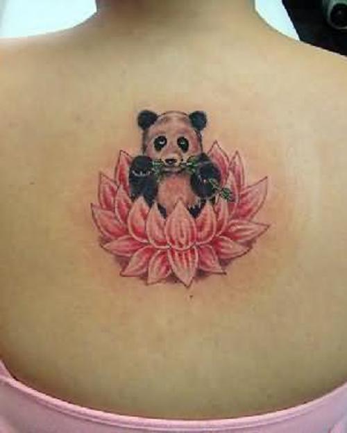 Nice Panda Eating Leaves Sitting On Flower Tattoo On Upper Back