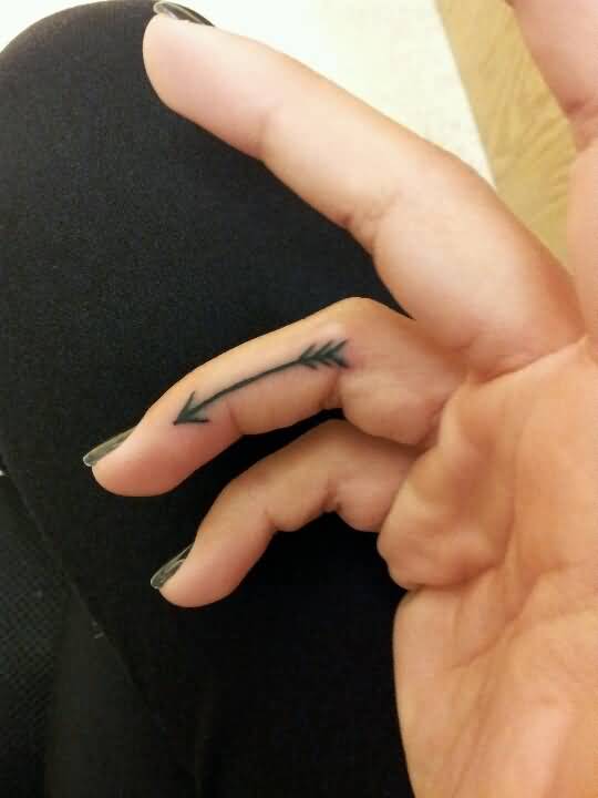 Nicely Designed Black Arrow Tattoo On Finger