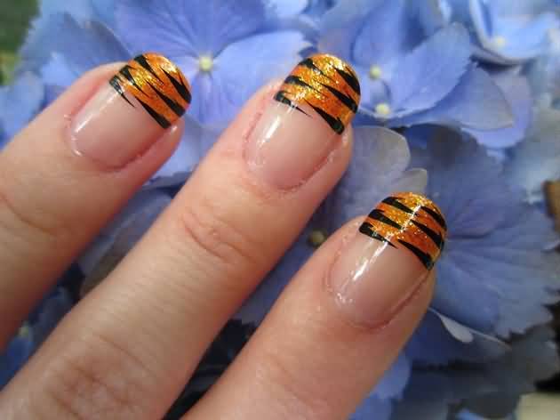 Orange Glitter Tiger Print French Tip Nail Art