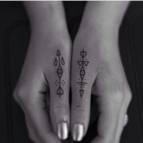 Outstanding Arrows Tattoos On Both Thumbs