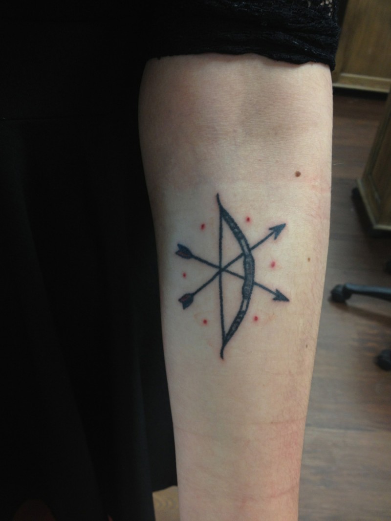 Outstanding Bow And Arrow With Red Dots Tattoo On Forearm