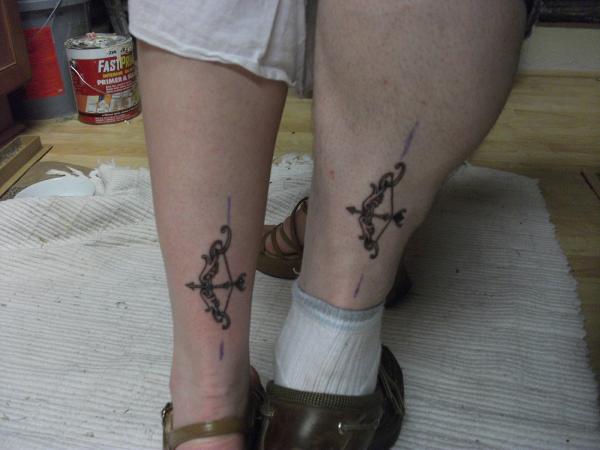 Outstanding Matching Bow And Arrow Tattoos On Both Leg