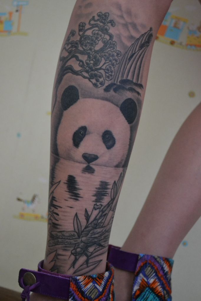 Panda Face Reflection In Water And Leafs Tattoo On Forearm