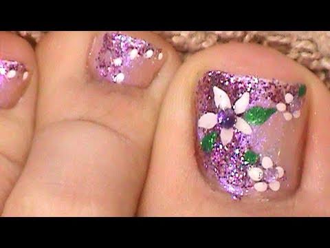 Purple Glitter Toe Nails With White Flower Nail Art
