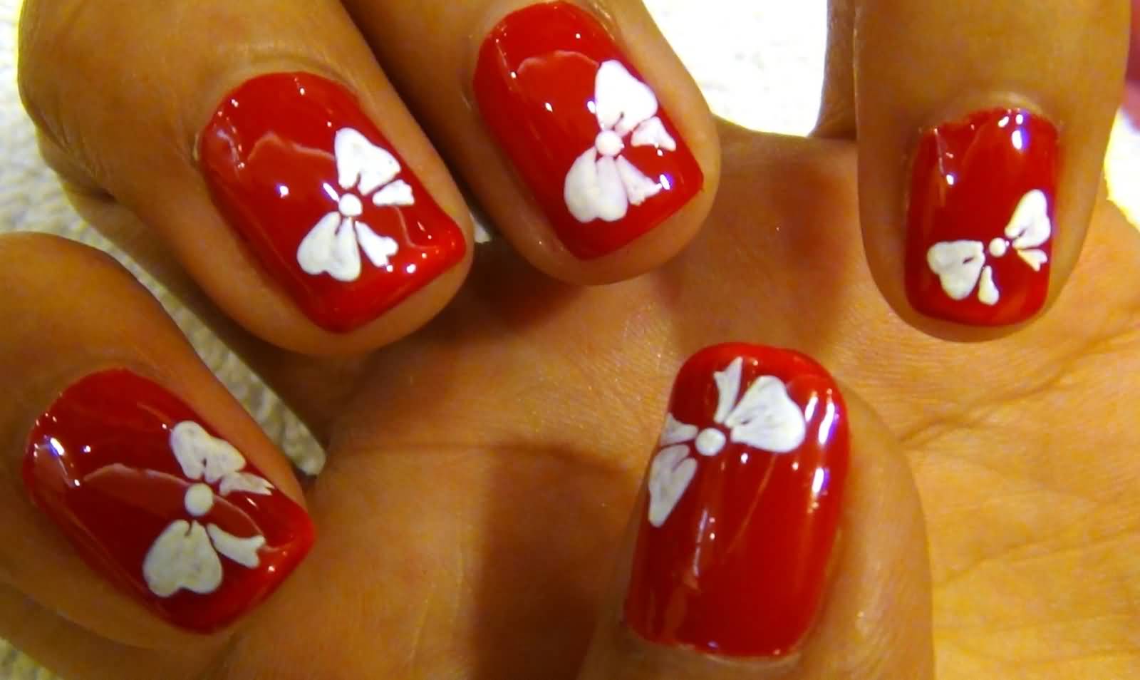 Red Flossy Nails With White Bows Nail Art
