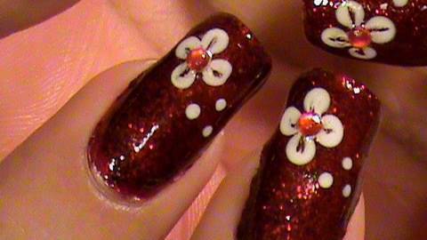 Red Glitter Nails With White Flower Nail Art