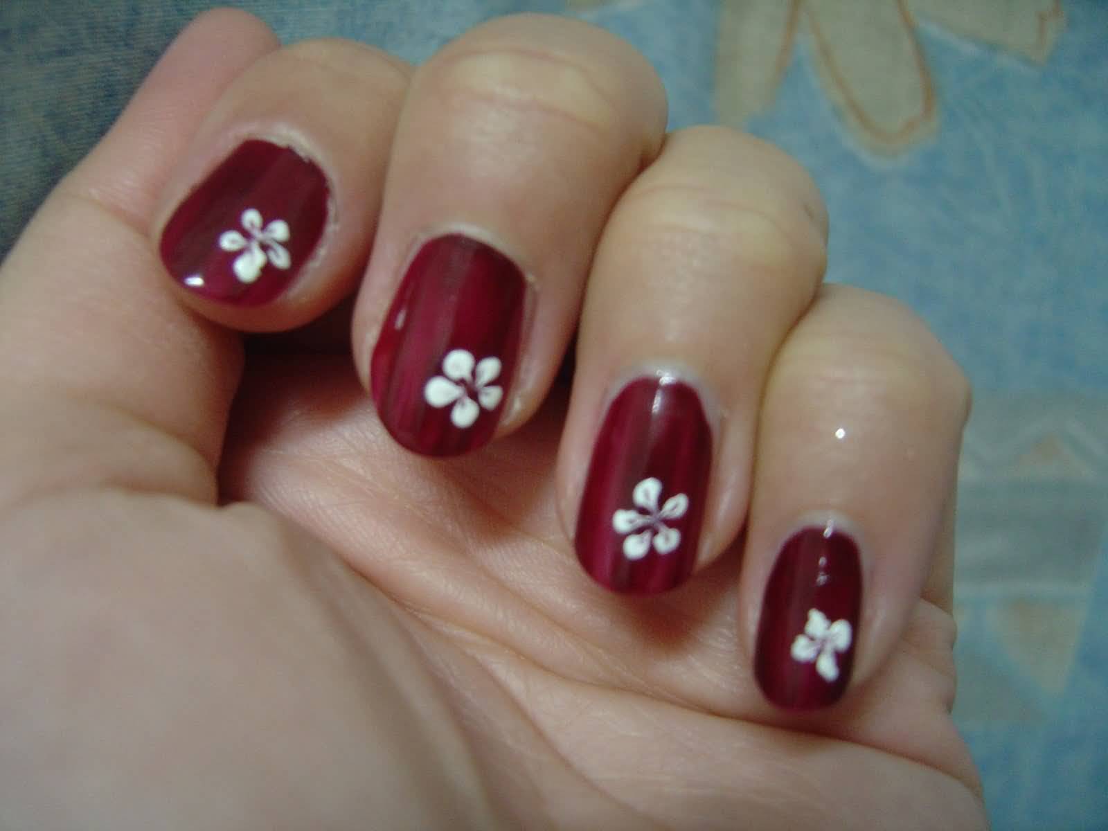 Red Nails With White Flower Nail Art