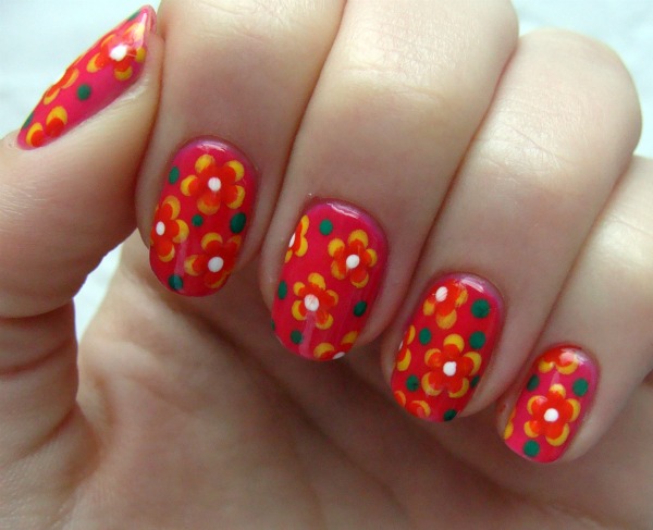 Red Nails With Yellow Flower Nail Art