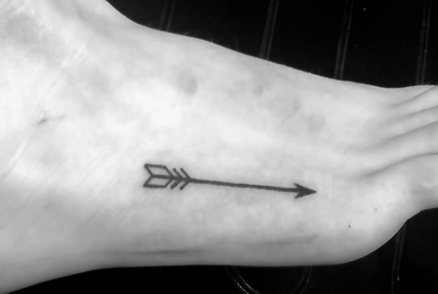 Simple Black Ink Arrow Tattoo On Foot