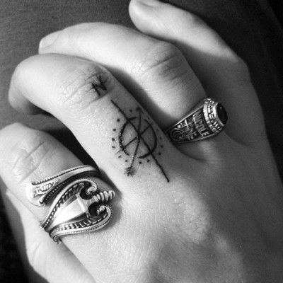 Simple Compass Tattoo On Finger
