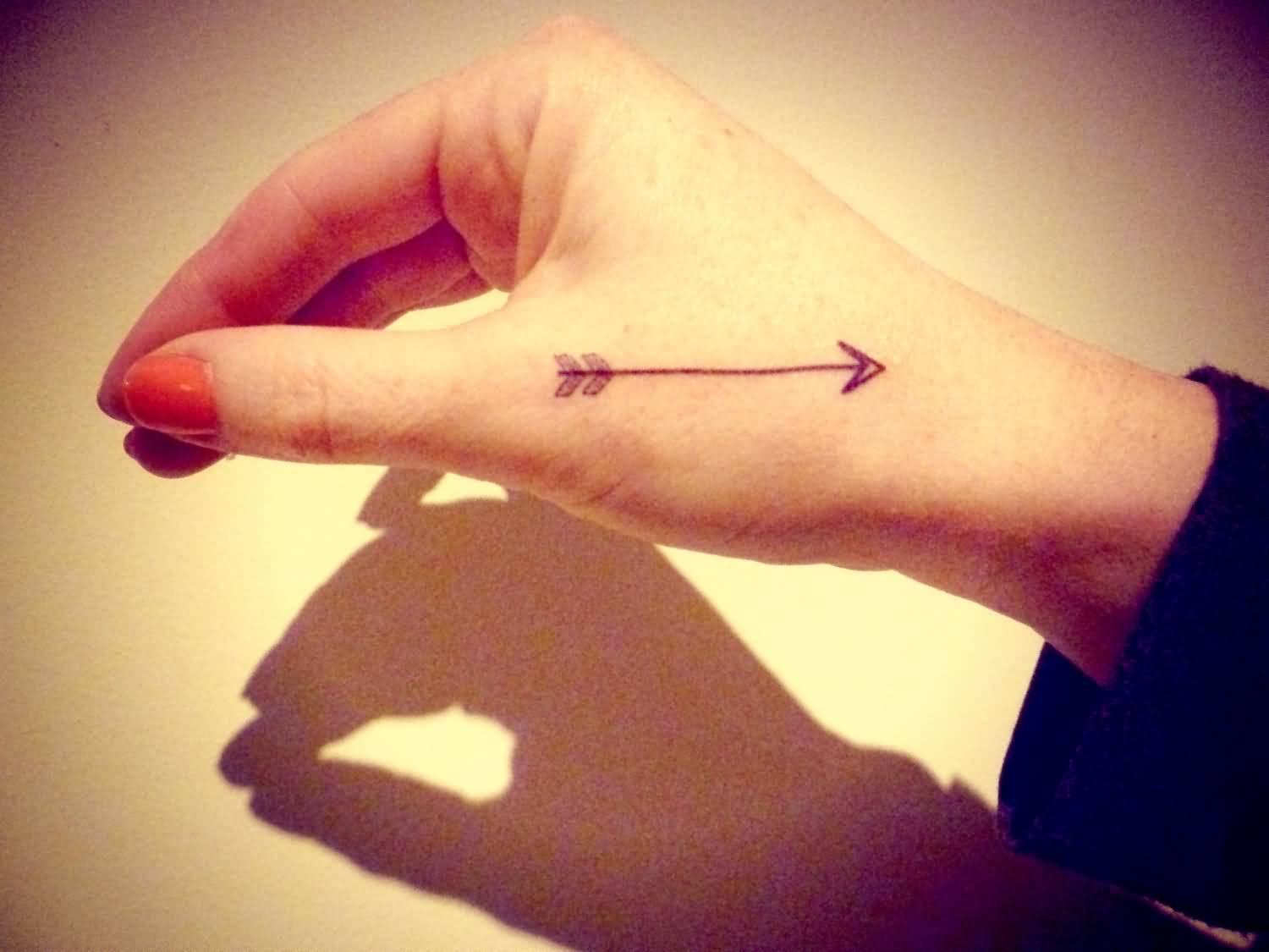 Small Arrow Tattoo On Hand For Women