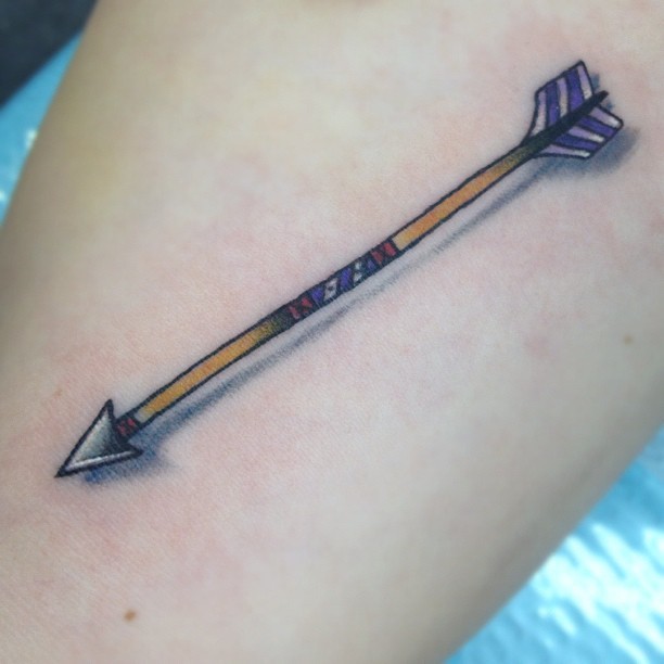 Small Colorful Tribal Arrow With Shadow Tattoo Design