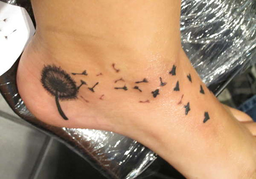 Small Tattoo Of Birds Flying From Dandelion Tattoo On Foot