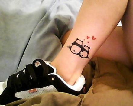 Small Two Pandas Sitting Together with Hearts Tattoo On Ankle