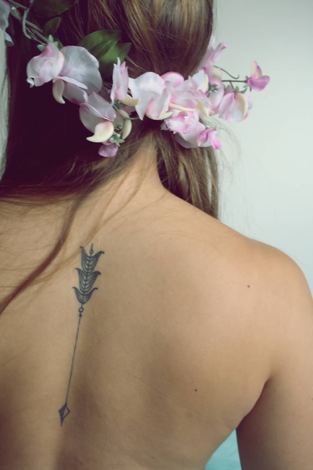 Superb Arrow Tattoo On Upper Back
