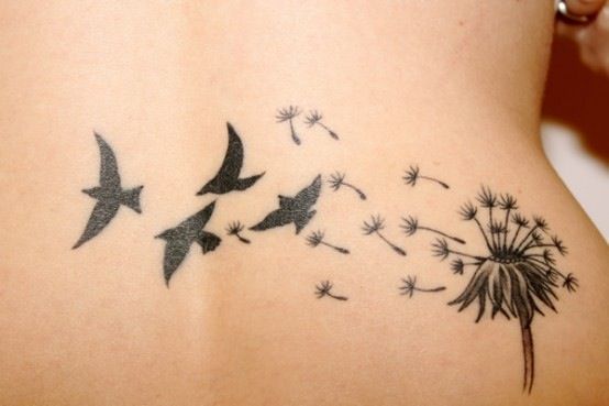 Superb Birds Flying From Dandelion Tattoo On Lower Back