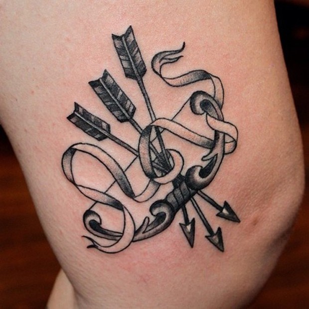 Superb Bow And Arrows With Ribbon Tattoo On Thigh