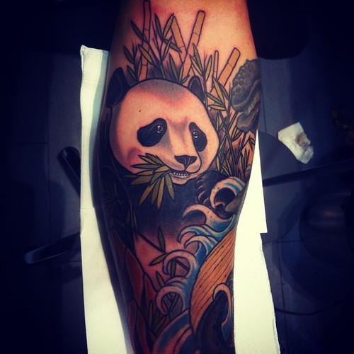 Superb Colorful Panda With Bamboos Tattoo On Arm