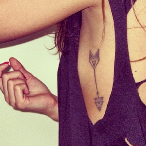 Terrific Arrow Tattoo On Rib