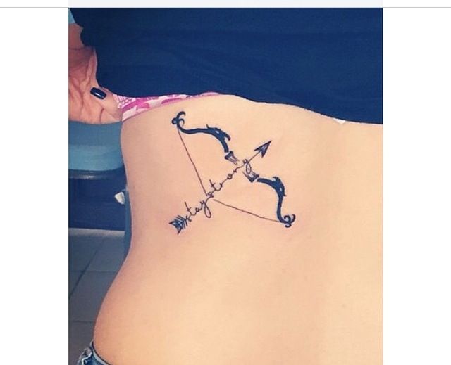 Terrific Bow And Arrow With Stay Strong Tattoo On Rib