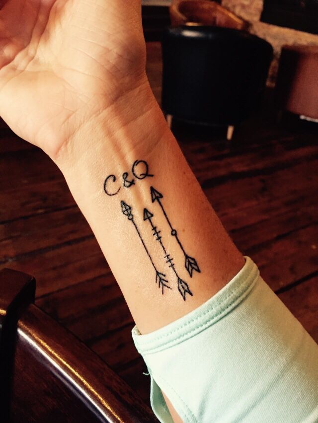 Three Amazing Arrows With C & Q Letter Tattoo On Wrist