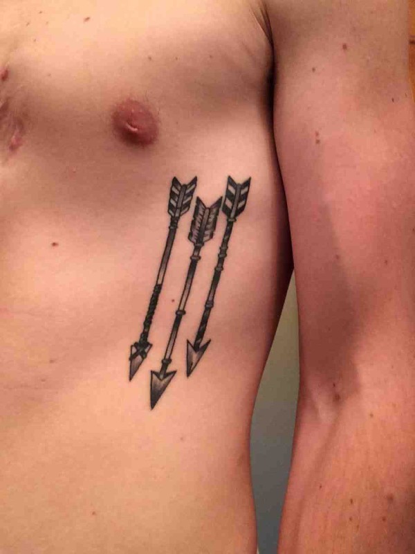 Three Awesome Tribal Arrows Tattoo On Rib