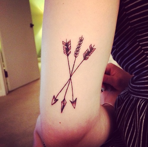 Three Crossed Arrows Tattoo On Arm